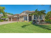 Lovely single-Gathering home with a well-manicured lawn and a three-car garage at 7407 Green St, Bradenton, FL 34201