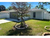 Charming single-story home with well-maintained lawn and lovely curb appeal at 1428 19Th St, Sarasota, FL 34234