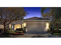 Charming single-story home with a well-manicured lawn and a two-car garage, providing both curb appeal and convenience at 4136 Cascade Falls Dr, Sarasota, FL 34243