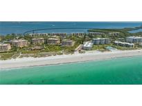 Stunning beachfront condos with crystal-clear turquoise waters and pristine white sand, a tropical paradise at 4760 Gulf Of Mexico Dr. Villa 7, Longboat Key, FL 34228
