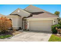 Charming single-story home featuring a two-car garage, neutral paint, and well-maintained landscaping at 8271 47Th Street E Cir, Palmetto, FL 34221