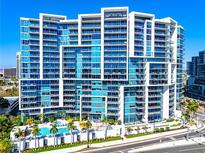 Stunning high-rise condo building featuring balconies and a luxurious pool at 1155 N Gulfstream Ave # 508, Sarasota, FL 34236