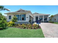 Charming single-story home with neatly landscaped front yard and blue shutters in a sunny neighborhood at 17916 Palmiste Dr, Bradenton, FL 34202