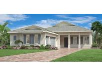 Charming one-story home features a symmetrical design, manicured lawn, and a paver driveway at 17916 Palmiste Dr, Bradenton, FL 34202