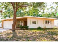 Charming single-story home with stone accents and a well-maintained front yard at 2110 Euclid Ter, Sarasota, FL 34239