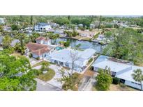 Waterfront home featuring lush landscaping, a private dock, and a spacious layout for luxurious coastal living at 3941 14Th Ne Ln, St Petersburg, FL 33703