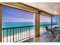 Enjoy the stunning ocean view from this cozy balcony, perfect for relaxation and outdoor dining at 4401 Gulf Of Mexico Dr # 907, Longboat Key, FL 34228
