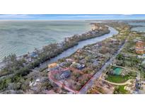 Beautiful waterfront property with lush surroundings, offering serene coastal living and stunning ocean views at 8555 Heron Lagoon Cir, Sarasota, FL 34242