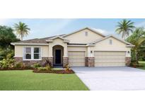 Charming single Gathering home featuring a three car garage and manicured lawn at 10713 Tippecanoe Pl, Parrish, FL 34219