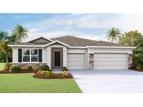 Charming single-Gathering home featuring stone accents, a two-car garage, and well-manicured landscaping at 10717 Tippecanoe Pl, Parrish, FL 34219