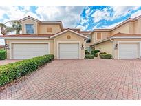 This townhouse has three garage spaces and brick driveway at 23261 Banbury Way # 501, Venice, FL 34293