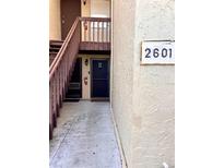 Building entrance with stairs, door B, and unit number 2601 visible at 2601 Pine Lake Ter # B, Sarasota, FL 34237