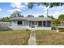 Charming single-story home featuring a screened porch and inviting walkway at 5001 15Th N Ave, St Petersburg, FL 33710