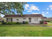 Cozy single-story home featuring a well-manicured lawn and inviting curb appeal at 1343 Glendale W Cir # 216, Sarasota, FL 34232