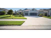 Charming single-story home featuring a two-car garage, well-manicured lawn, and inviting curb appeal at 4308 Fly Rod Ter, Parrish, FL 34219