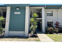 Inviting condo exterior showcases a well-maintained facade, lush landscaping, and a welcoming entrance at 4325 46Th W Ave # 202, Bradenton, FL 34210