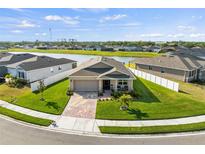 Charming single-Gathering home with well-manicured lawn, brick paved drive and stunning pond view at 3478 74Th Avenue E Cir, Sarasota, FL 34243