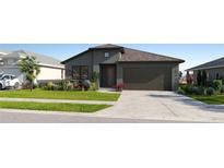 Inviting single-Gathering home featuring a manicured lawn, desert landscaping, and a neutral color palette at 11822 Moonsail Dr, Parrish, FL 34219