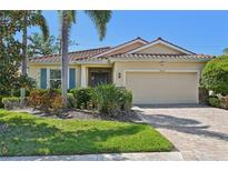 Charming one-story home with a clay tile roof, two-car garage, and well-maintained landscaping at 3018 Oriole Dr, Sarasota, FL 34243