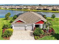 Beautiful home with a three car garage and a lake view at 5811 Campina Pl, Palmetto, FL 34221