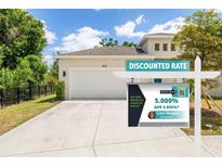Attractive home featuring an attached garage, and lush landscaping at 1800 Little Bird Ct, Sarasota, FL 34235