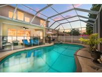 Inviting screened pool area with sun loungers and a built-in hot tub, perfect for relaxation at 5915 43Rd E Ct, Bradenton, FL 34203