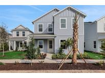Charming two-story home featuring a well-maintained front yard with lush landscaping at 9035 Duany Ln, Lakewood Ranch, FL 34240