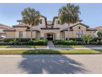 Stunning condo with lush landscaping and mature palm trees at 23572 Awabuki Dr # 202, Venice, FL 34293