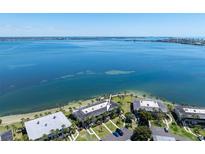 Breathtaking aerial view of the waterfront condo complex and beautiful bay waters at 6500 Flotilla Dr # 126, Holmes Beach, FL 34217