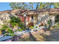 Inviting home exterior features a well-manicured front yard with decorative plants and a charming walkway at 1533 42Nd Avenue E Dr # 48, Ellenton, FL 34222