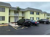 Inviting condo building featuring a well-maintained exterior and convenient parking at 6703 Midnight Pass Rd # 206, Sarasota, FL 34242