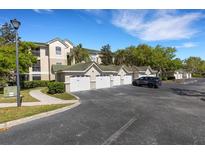 Attached garages provide convenient parking near this condo building with lush landscaping and ample parking spaces at 5122 Northridge Rd # 112, Sarasota, FL 34238