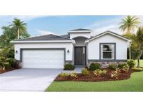 Charming single-Gathering home featuring a two-car garage, well-manicured lawn, and tropical landscaping at 17917 Tavernside Trl, Lakewood Ranch, FL 34211