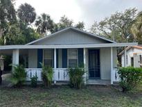 Charming single-story home featuring a covered front porch and quaint architectural details at 29 Michiana Dr, Terra Ceia, FL 34250