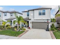 Charming two-story home with well-manicured landscaping and a two-car garage at 5426 Rainwood Meadows Dr, Apollo Beach, FL 33572