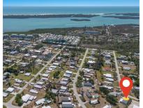 Community aerial view showcasing proximity to pristine beaches and sparkling ocean waters at 8225 Drew St, Englewood, FL 34224