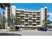 A full view of the condo complex with multi-story residential units, parking and landscaping around the property at 1095 Gulf Of Mexico Dr # 503, Longboat Key, FL 34228