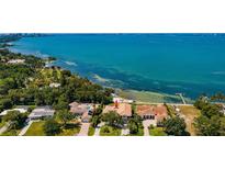 Stunning waterfront property with lush landscaping and beautiful views of the bay at 404 S Shore Dr, Sarasota, FL 34234