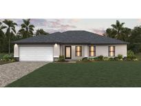 Charming single-story home featuring a manicured lawn and a two-car garage at 16085 Edina Ave, Port Charlotte, FL 33954