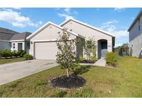 Charming single-story home with a well-maintained lawn, tidy landscaping and attached two-car garage at 2812 Rock Sound St, Bradenton, FL 34208