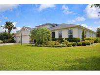 Lovely one-story home with a 3-car garage, attractive landscaping, manicured lawn, and freshly painted exterior at 2918 130Th E Ave, Parrish, FL 34219