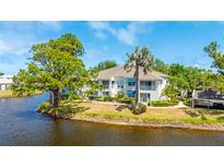 Charming waterfront condo featuring serene water views and inviting outdoor balconies at 304 108Th W St, Bradenton, FL 34209