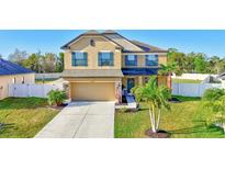 Attractive two-story home featuring a well-manicured lawn and welcoming curb appeal at 4010 Lindever Ln, Palmetto, FL 34221