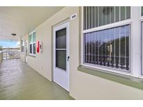 Exterior hallway featuring unit 308's door, a window, and outdoor access at 4885 1St Ne St # 308, St Petersburg, FL 33703