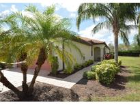 Charming home featuring lush landscaping, a terracotta roof, and a welcoming entryway at 6740 Willowshire Way, Bradenton, FL 34212