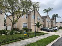Charming townhome featuring an attached one-car garage and lovely, mature landscaping at 3938 Yellowstone Cir, Sarasota, FL 34233