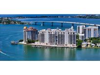 Waterfront condos with docks offer boat access and stunning ocean views under the bridge at 464 Golden Gate Pt # 702, Sarasota, FL 34236