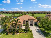 Beautiful single-story home with tile roof, well-manicured lawn, landscaping and proximity to the golf course at 5637 Arnie Loop, Bradenton, FL 34211