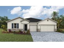Charming single-story home featuring a three-car garage and stone accents at 17134 James Trl, Parrish, FL 34219