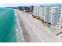 Stunning aerial view of the beachfront condos and pristine white sand beach at 1750 Benjamin Franklin Dr # 6B, Sarasota, FL 34236